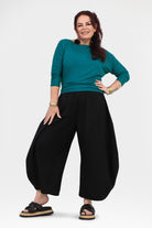 Black wide-leg pants, relaxed gathered waist