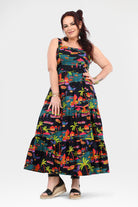 Sleeveless maxi dress with tropical multicolor print, cinched waist and flared hem