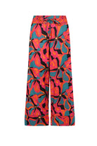 Pink and teal printed wide-leg pants with bold floral motif, elastic waist with drawstring