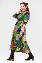 Woman wearing a colorful patterned dress on a white background