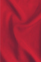 Dark red woven dress fabric close-up