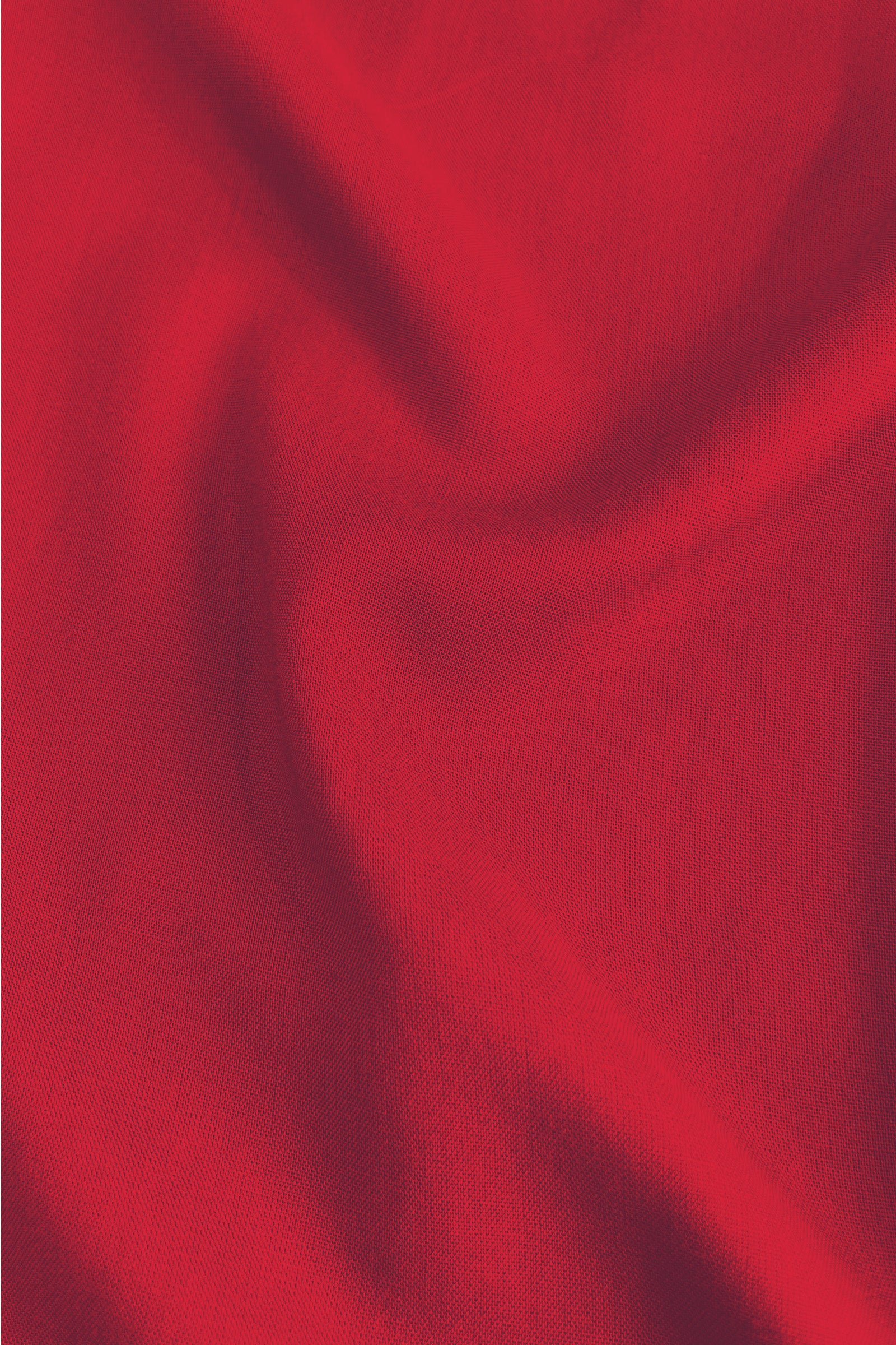 Dark red woven dress fabric close-up