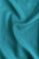 Teal button-front blouse top with V-neck and soft fabric texture